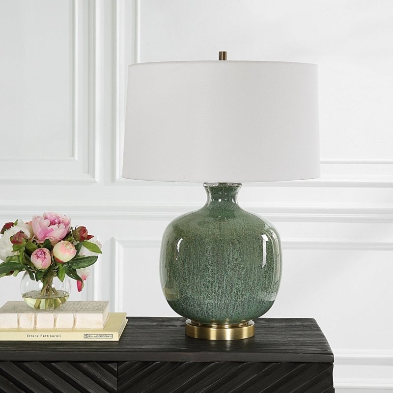 aged green ceramic table lamp styled in a modern living room with warm neutral decor