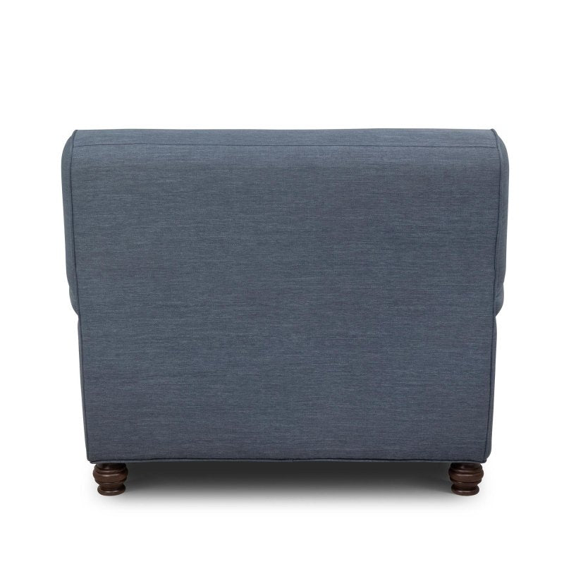 Rear view of the Kenwood heathered navy blue upholstered chair showing its tailored back and turned wood feet