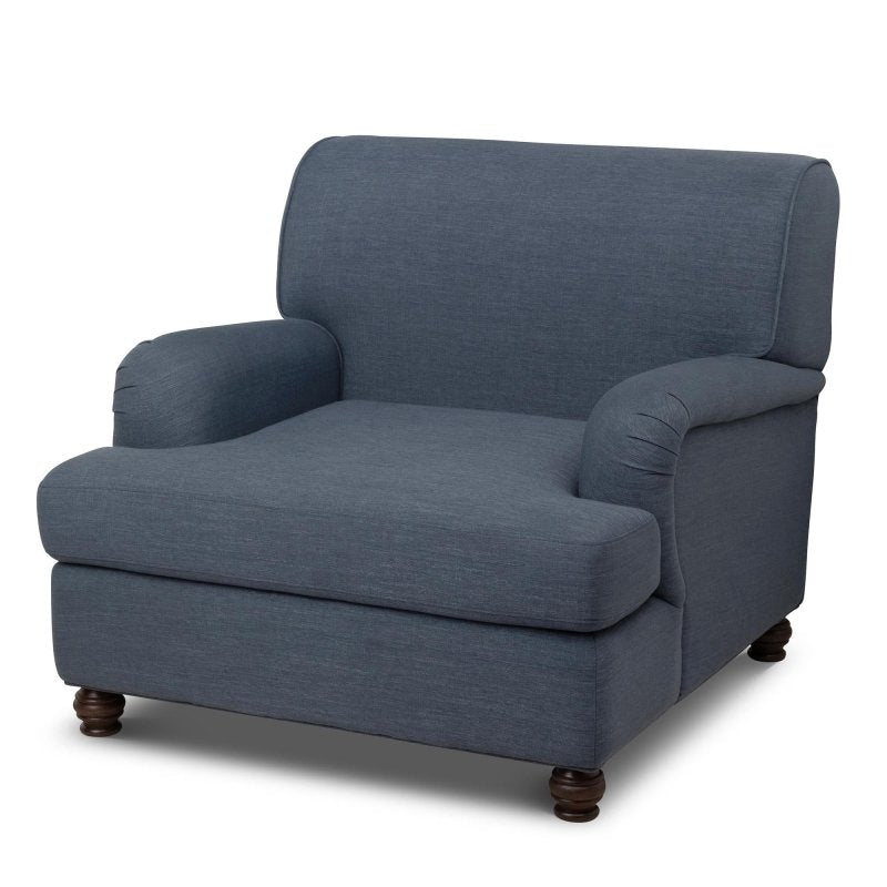Three-quarter view of the Kenwood heathered navy blue upholstered accent chair with a loose seat cushion and turned wood feet