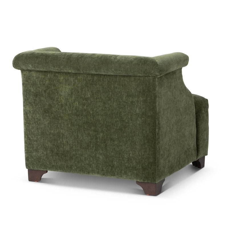 Rear three-quarter view of the Scroll Arm moss green accent chair with an upholstered back and wood block feet