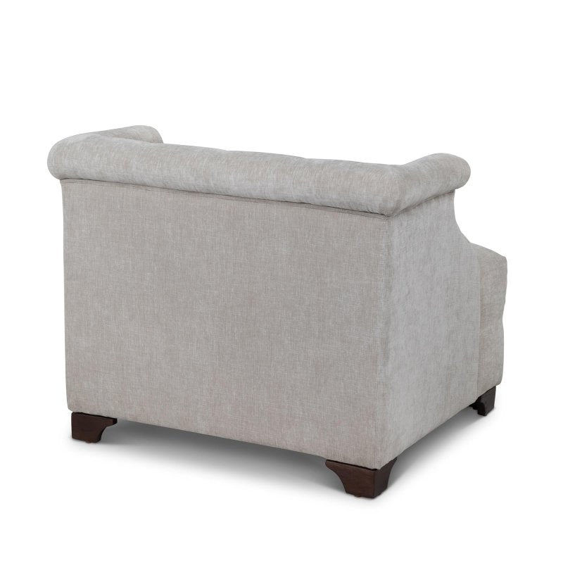 Rear three-quarter view of the Scroll Arm putty gray accent chair with an upholstered back and wood block feet