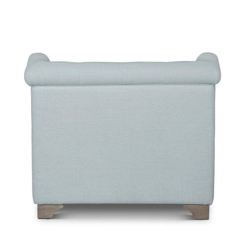 Rear view of the Scroll Arm Serene Sky blue upholstered chair showing its tailored back and rolled crest