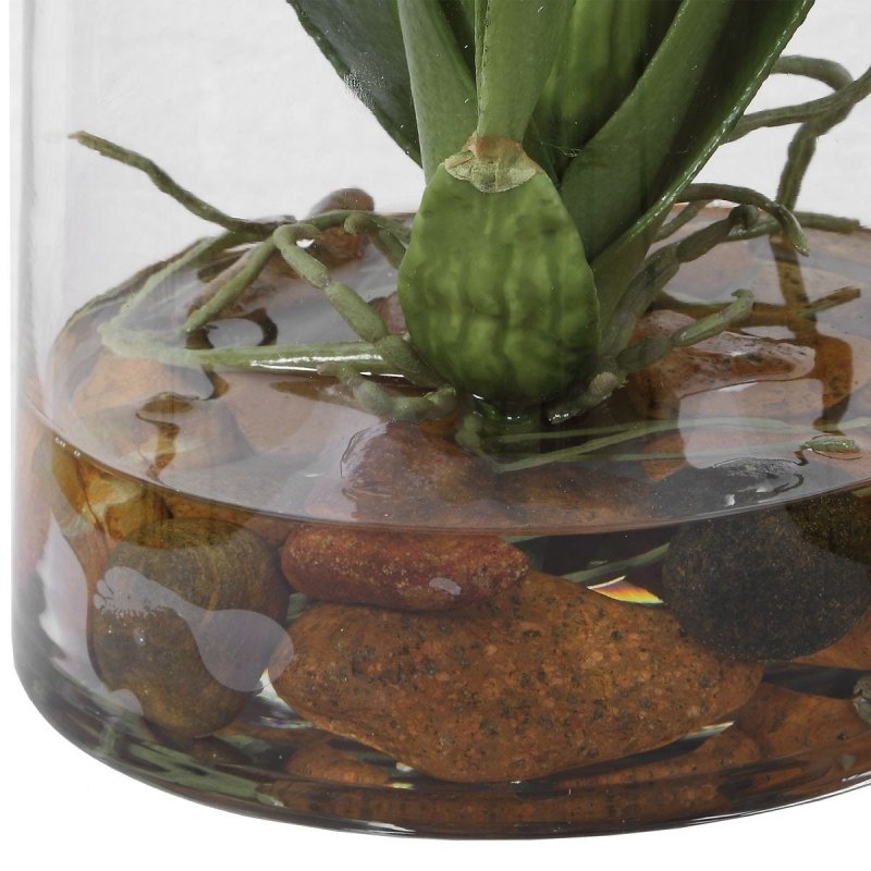 Close-up of the Dancing Orchid glass container with faux water and stones