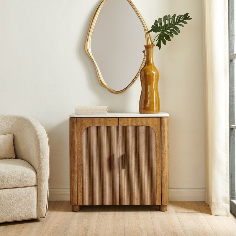 Mebarak 2 Door Cabinet styled with a vase and mirror