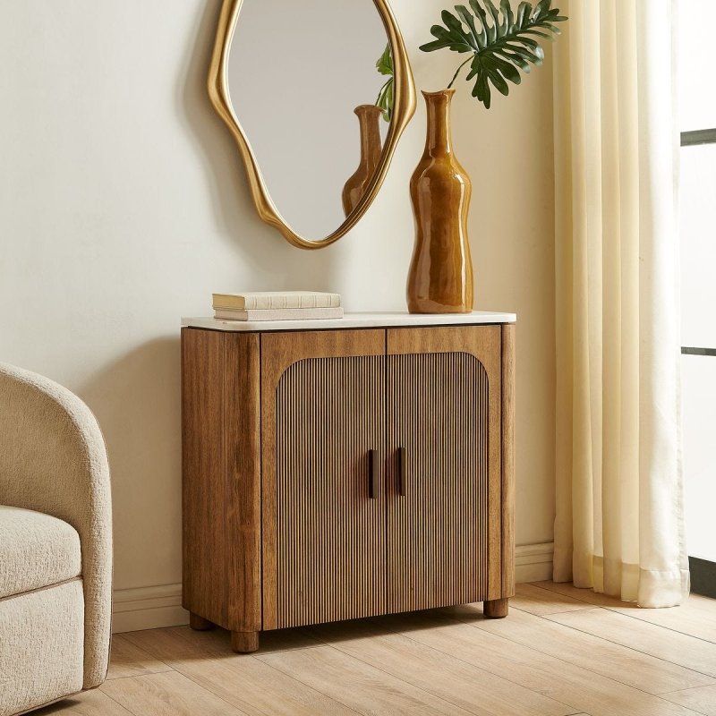 Mebarak 2 Door Cabinet styled beneath a wall mirror
