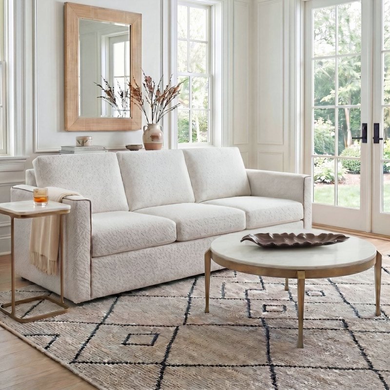 Side profile of the Tylan White Marble Round Coffee Table by Uttermost