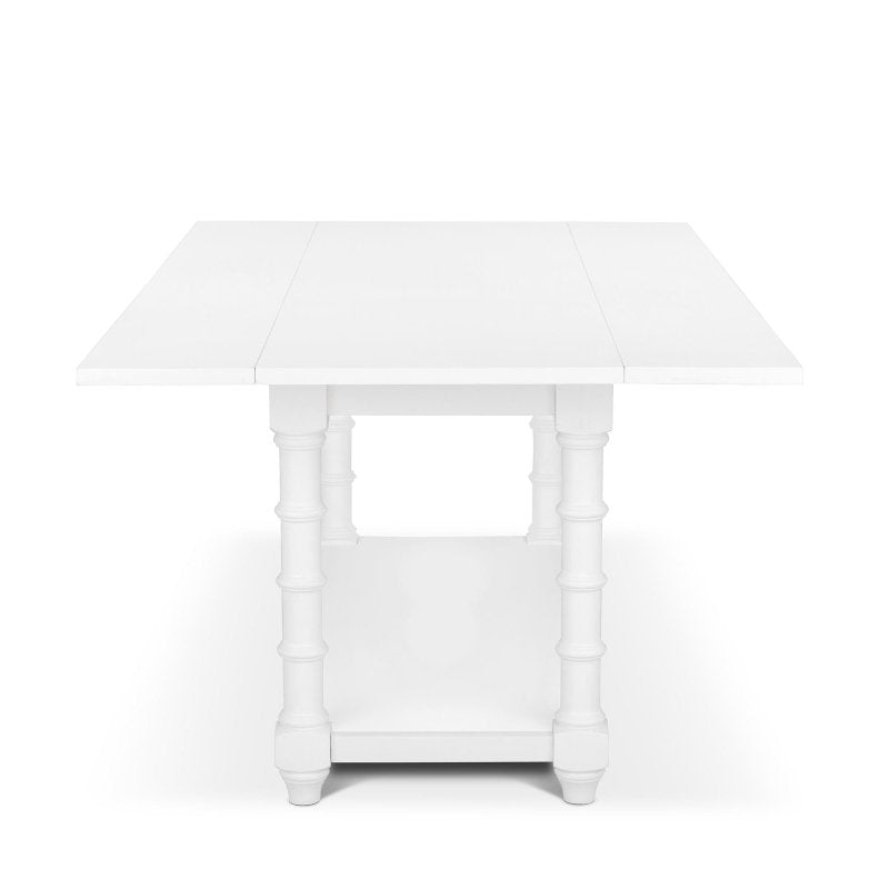 End view of the Bimini whitewash drop-leaf table showing the extended top, faux bamboo legs and lower shelf