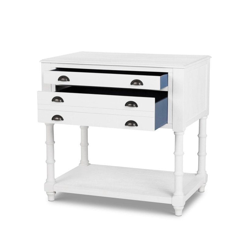 Bimini whitewash kitchen island with all three drawers open to show dark blue interiors and black cup pulls