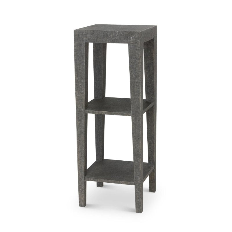 Three-quarter view of the Giraffe Leg dark Seal brown faux raffia pedestal with two open shelves and tapered legs