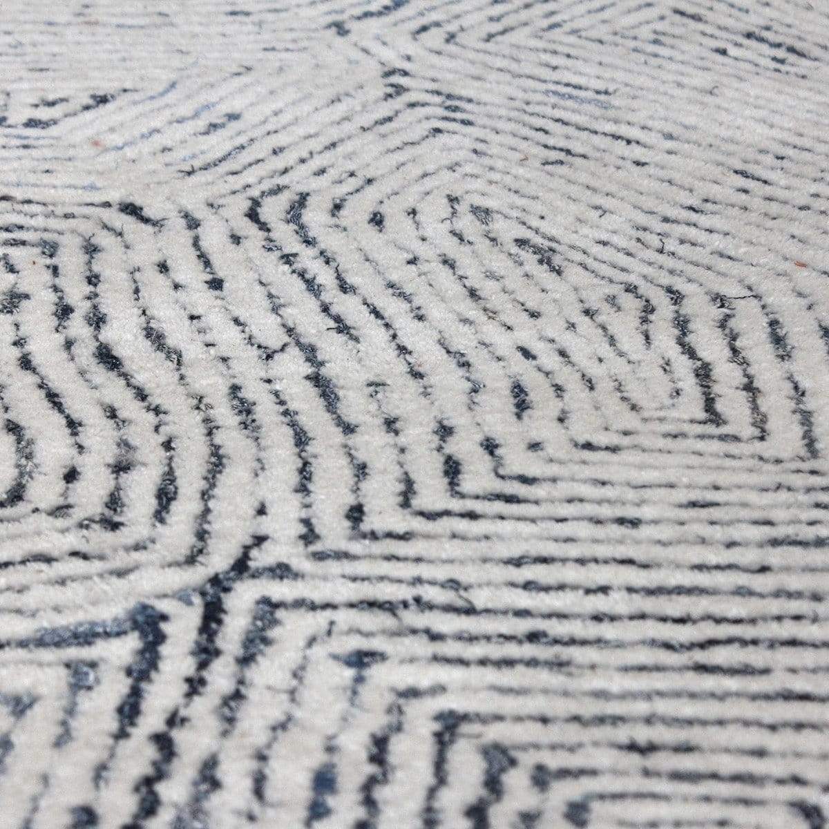 Close-up texture of Uttermost Maze wool and rescued denim rug