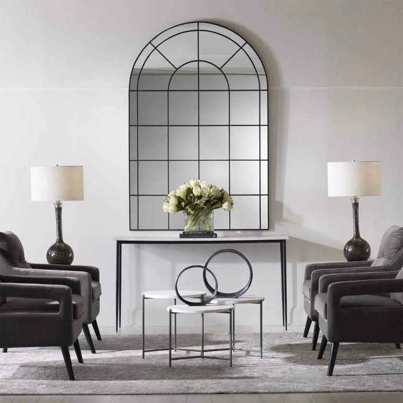 statement arched wall mirror in room setting