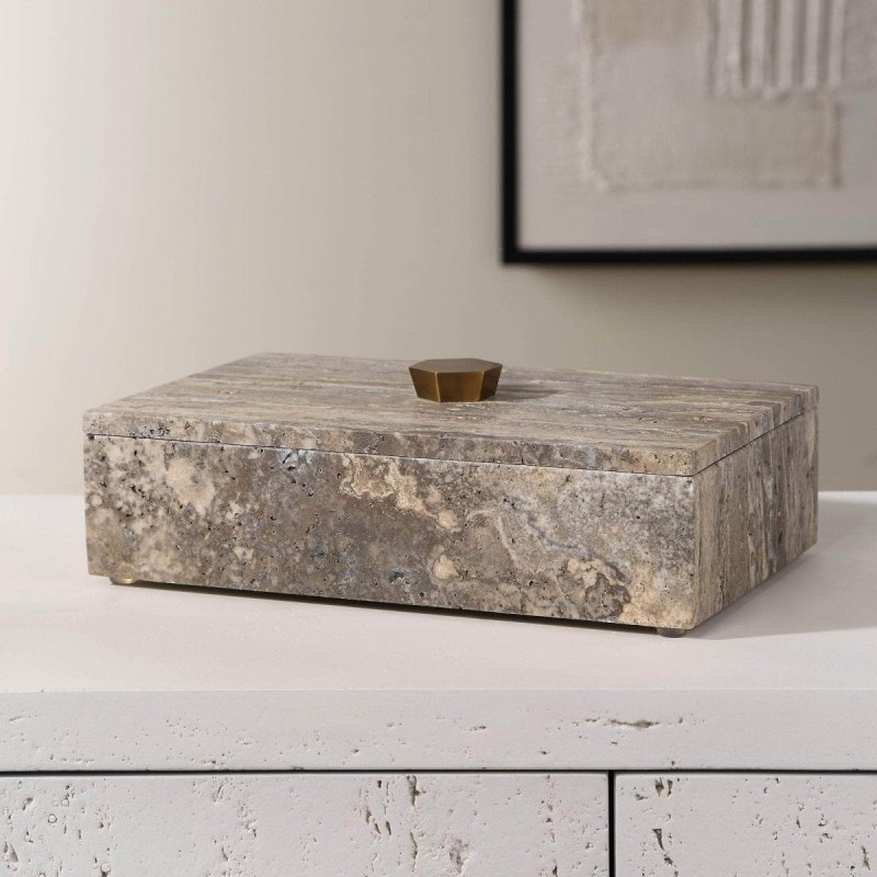 Travertine stone decorative box with lid styled on a coffee table