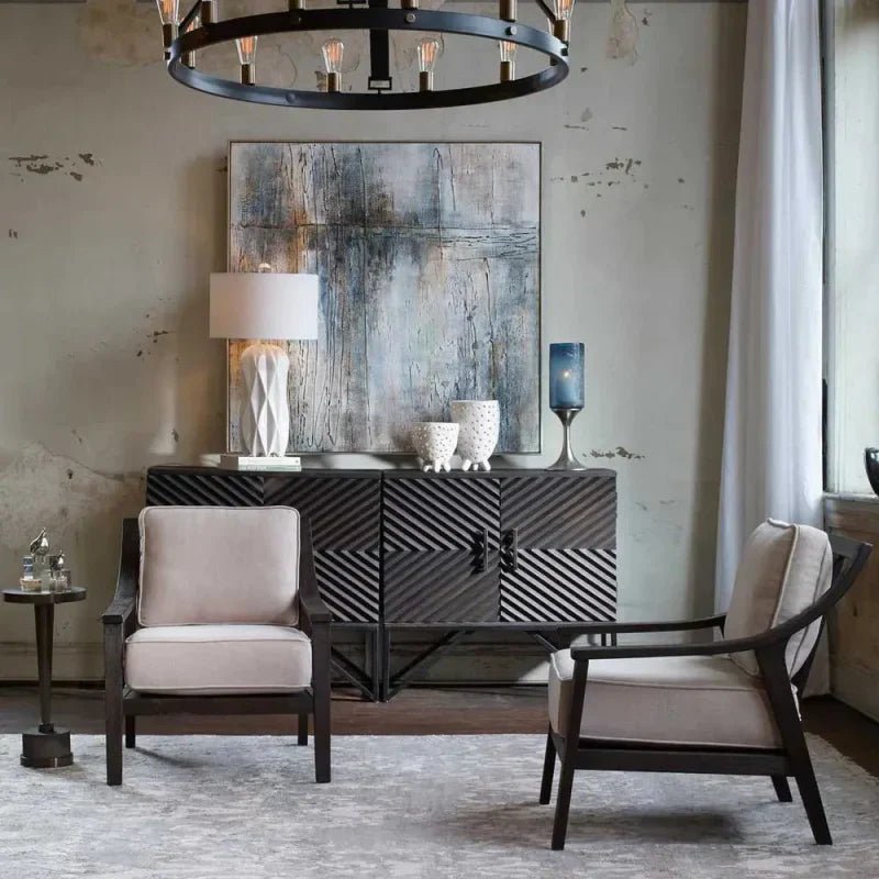 Uttermost Zadie Chevron Pattern Cabinet styled in a modern living room with neutral accent chairs, abstract wall art, and soft layered lighting