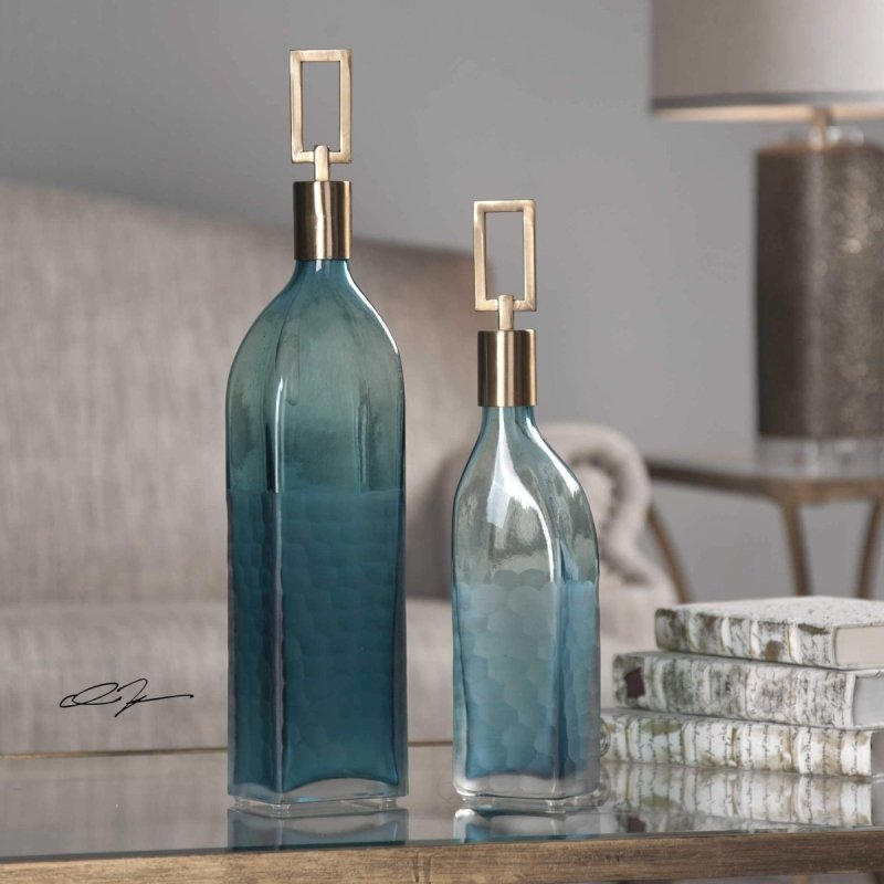 Decorative glass bottles and vases in various shapes and finishes for modern interiors