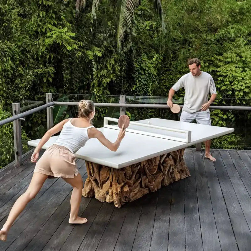 coupole playing table tennis outdoors on the new dining table that turns into a ping pong table instantly