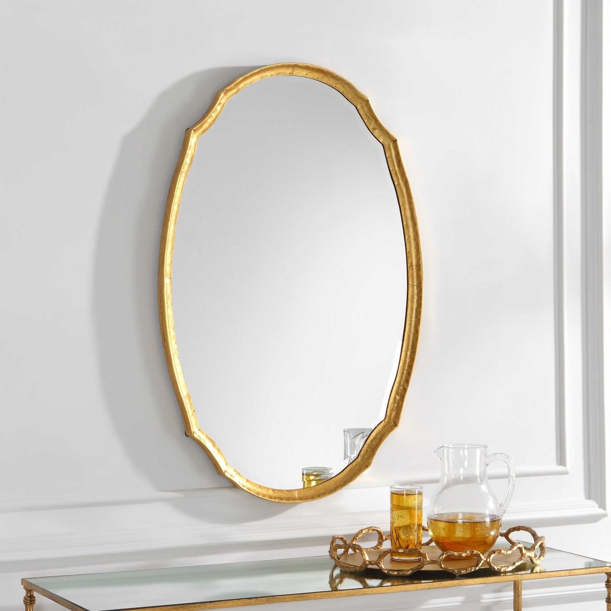 A gold Oval modern wall mirror by Modest Hut