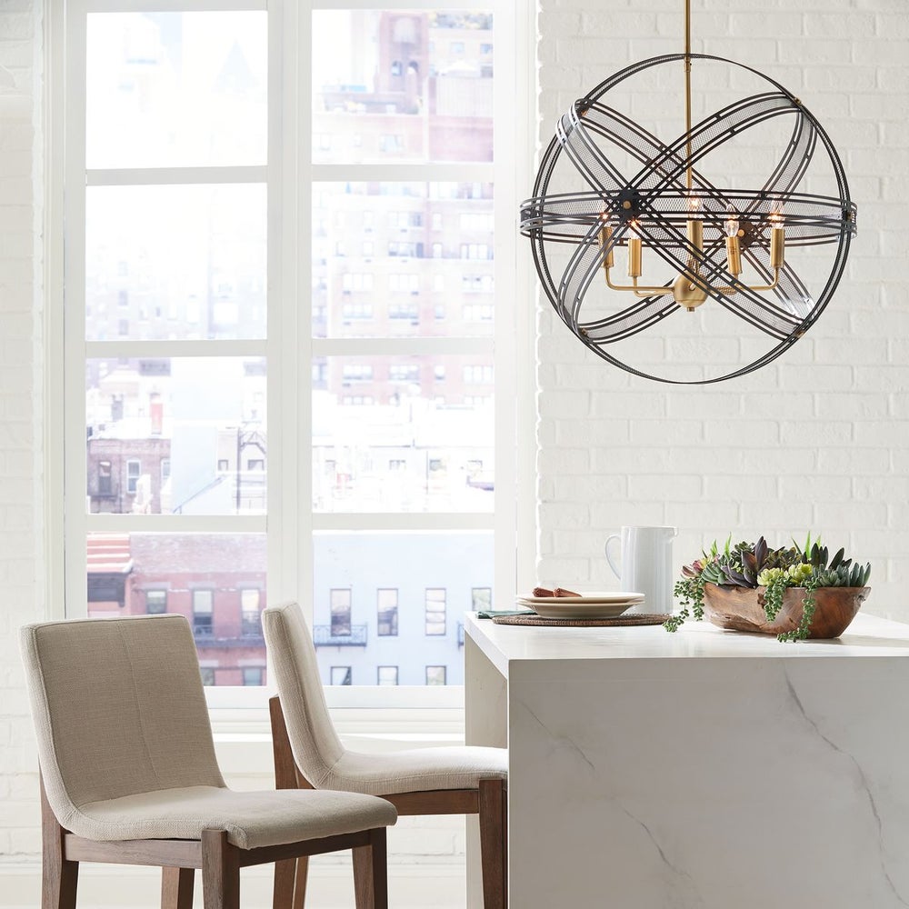 Modern pendant lights hanging over kitchen island with contemporary glass and metal finishes