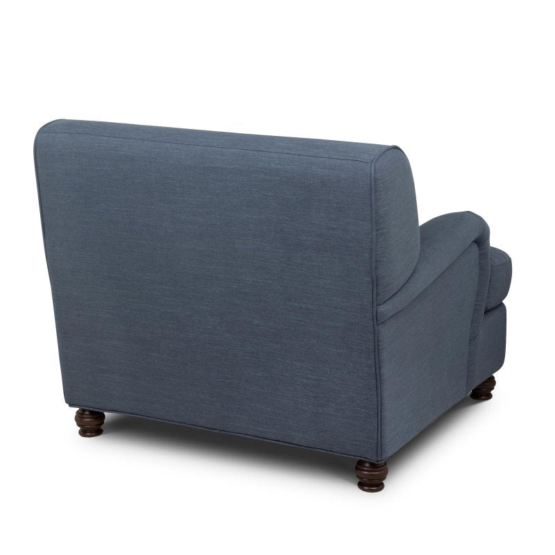 Rear three-quarter view of the Kenwood heathered navy blue upholstered accent chair and curved back silhouette