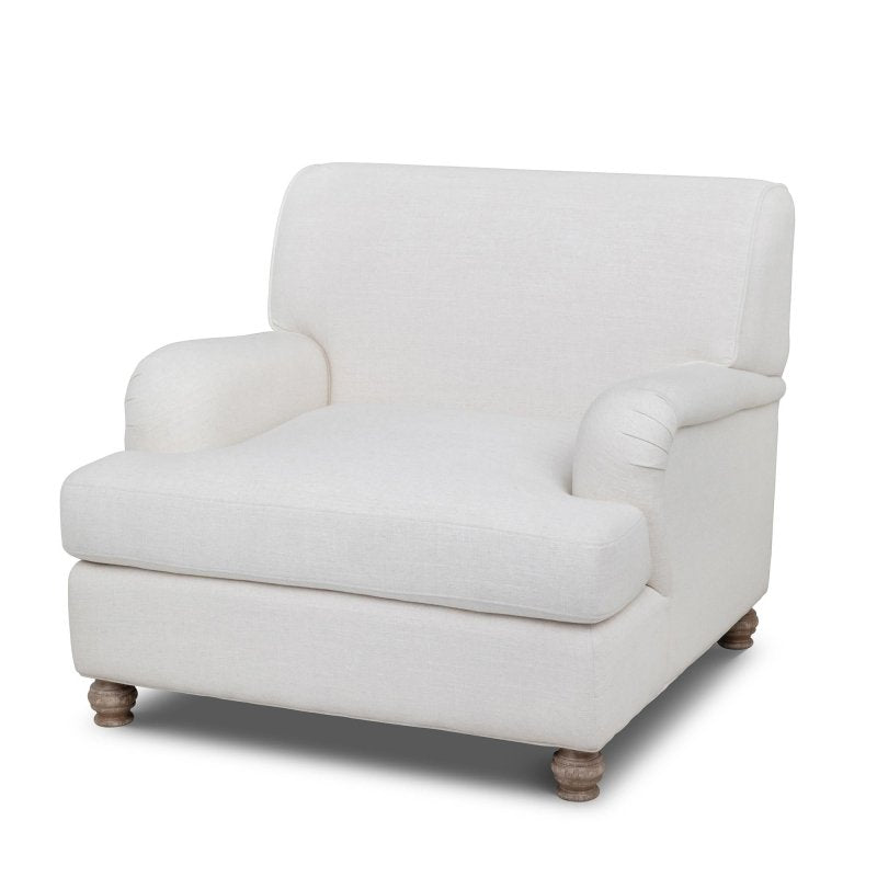Three-quarter view of the Kenwood ivory upholstered accent chair with a loose seat cushion and turned wood feet