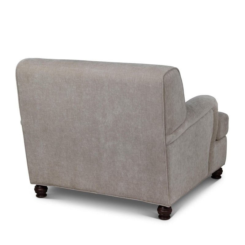Rear three-quarter view of the Kenwood putty gray upholstered accent chair and curved back silhouette