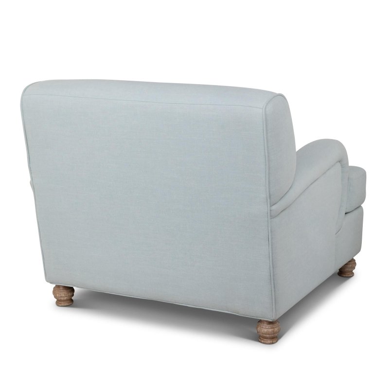 Rear three-quarter view of the Kenwood Serene Sky blue upholstered accent chair and curved back silhouette
