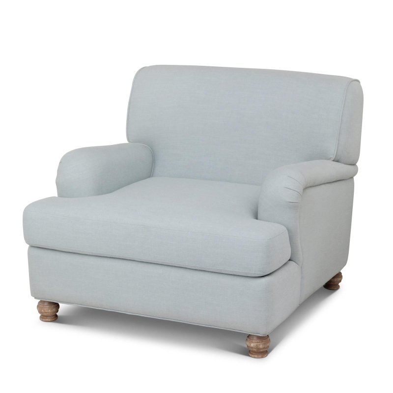 Three-quarter view of the Kenwood Serene Sky blue upholstered accent chair with a loose seat cushion and turned wood feet