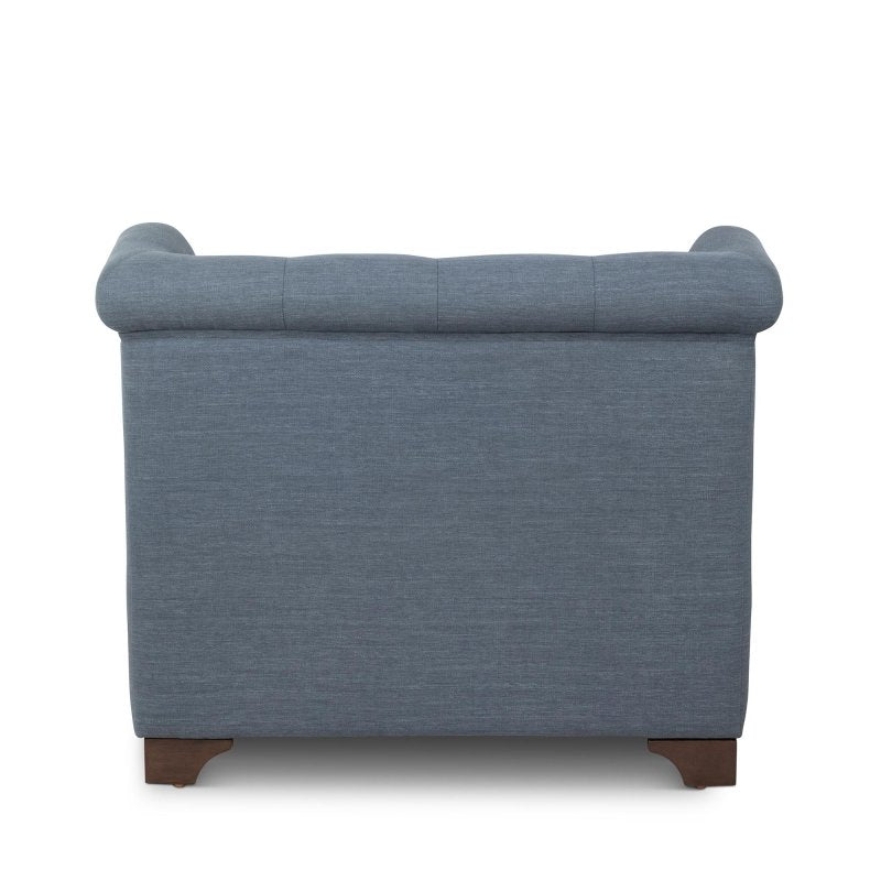 Rear view of the Scroll Arm heathered navy blue upholstered chair showing its tailored back and rolled crest