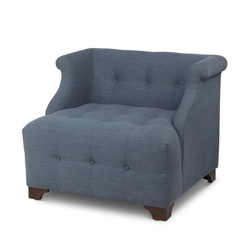 Three-quarter view of the Scroll Arm heathered navy blue accent chair with button tufting, rolled arms and wood block feet