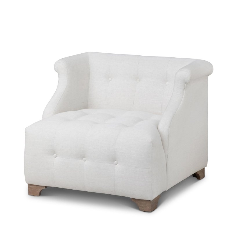 Three-quarter view of the Scroll Arm ivory accent chair with button tufting, rolled arms and wood block feet