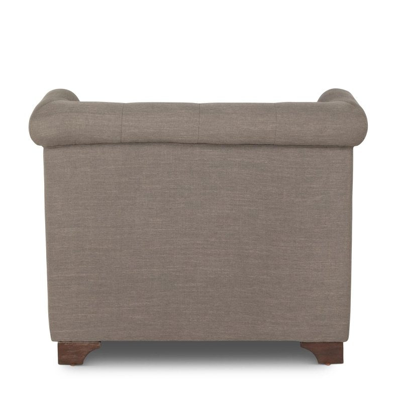 Rear view of the Scroll Arm mocha brown upholstered chair showing its tailored back and rolled crest