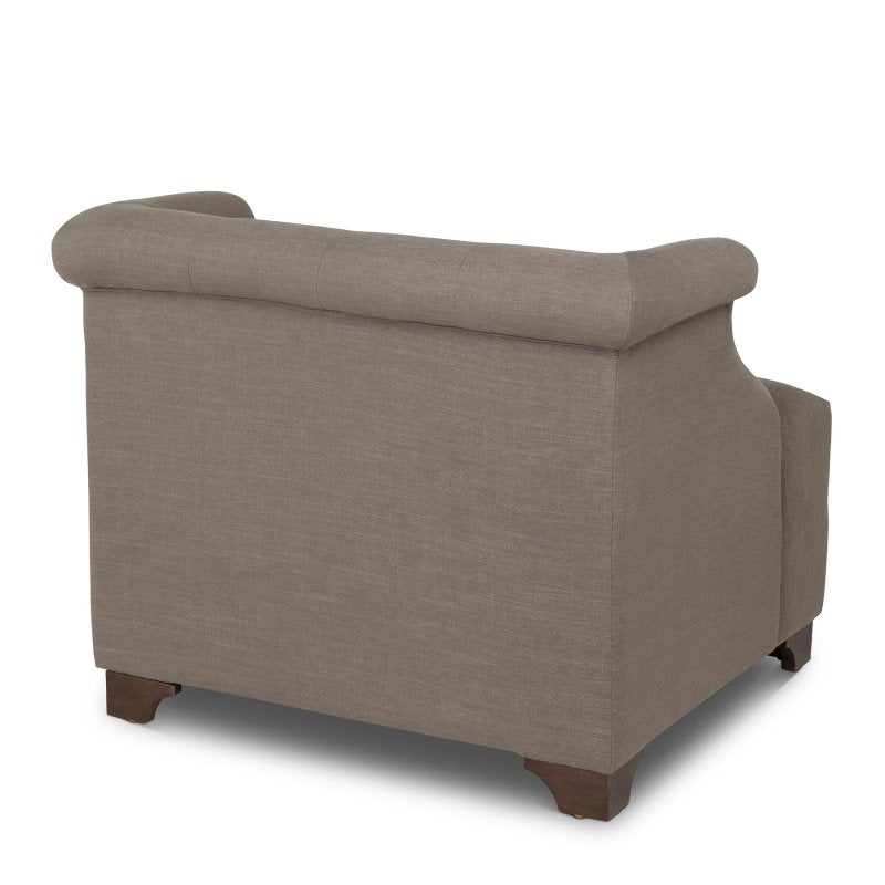 Rear three-quarter view of the Scroll Arm mocha brown accent chair with an upholstered back and wood block feet