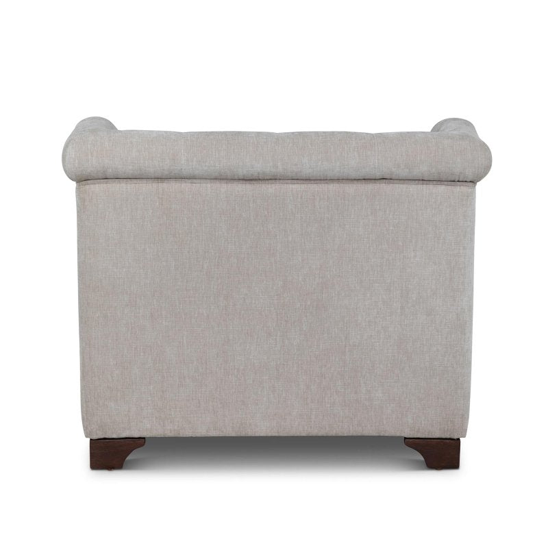 Rear view of the Scroll Arm putty gray upholstered chair showing its tailored back and rolled crest