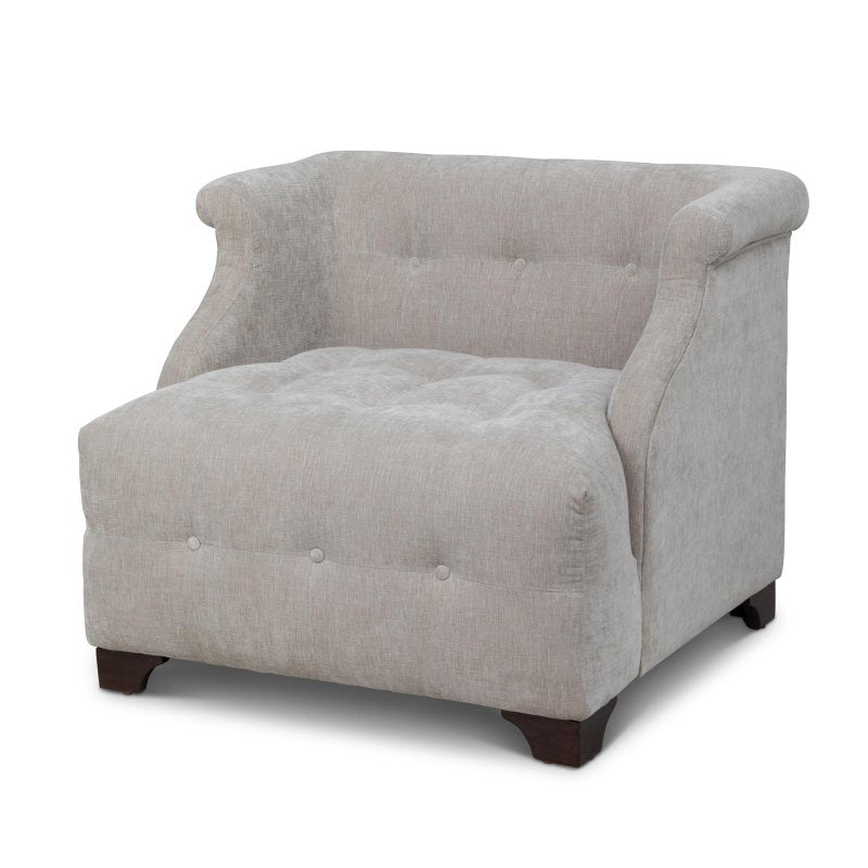 Three-quarter view of the Scroll Arm putty gray accent chair with button tufting, rolled arms and wood block feet