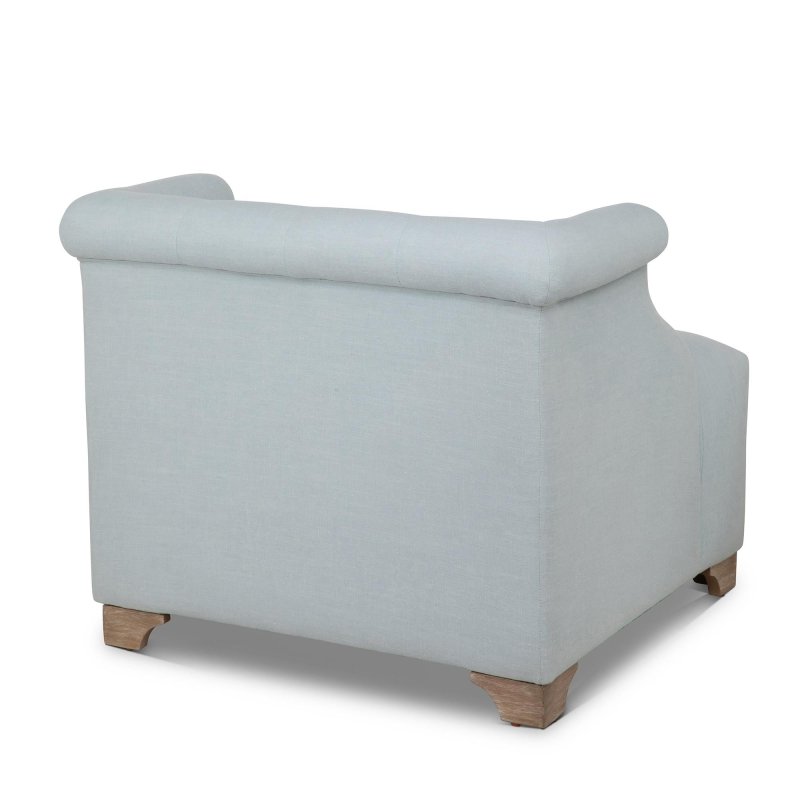 Rear three-quarter view of the Scroll Arm Serene Sky blue accent chair with an upholstered back and wood block feet