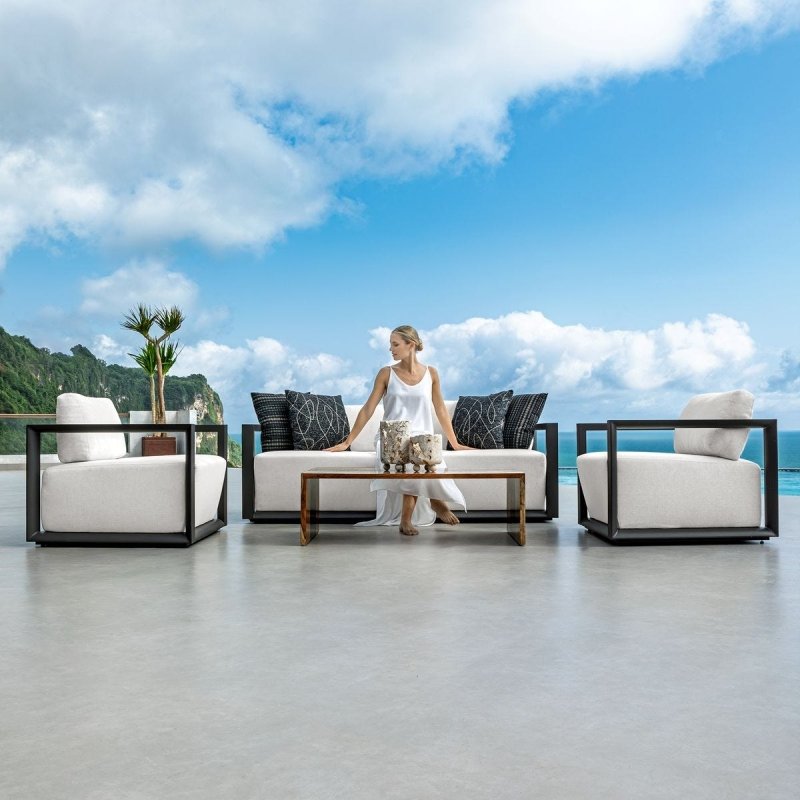 Remsen Outdoor Lounge Chair Java Black/Oyster styled in an outdoor setting