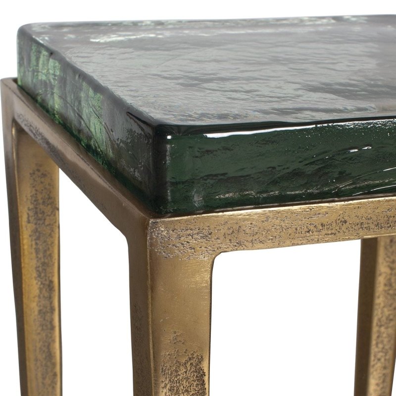 Detail view of antiqued brass frame on the Preston Square Glass Accent Table