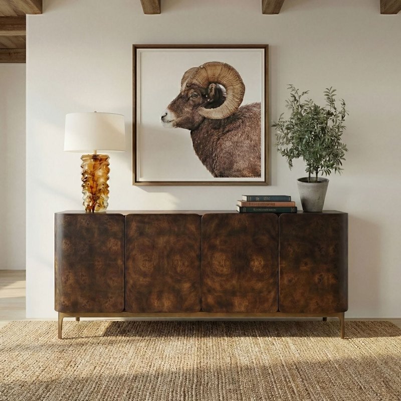 Melbourne Mappa Burl 4-Door Cabinet styled in a dining or living room beneath framed art