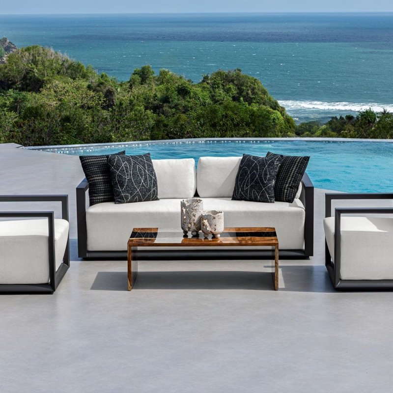 Quarried Stone Indoor-Outdoor Candleholders Set of 2 styled in a outdoor coffee table with patio seating