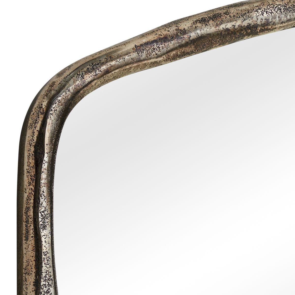 Side view of the Hammered Antique Nickel Arched Mirror by Uttermost