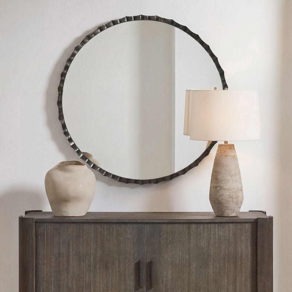 Grander Charcoal Scalloped Round Mirror styled in a wall setting