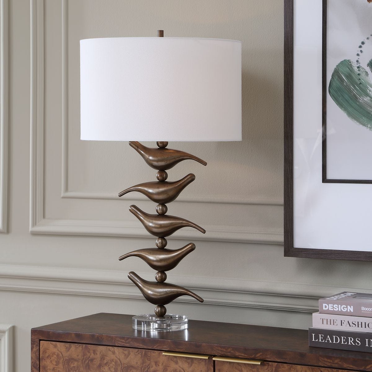 Sing Song Golden Bronze Bird Table Lamp styled in a styled room setting