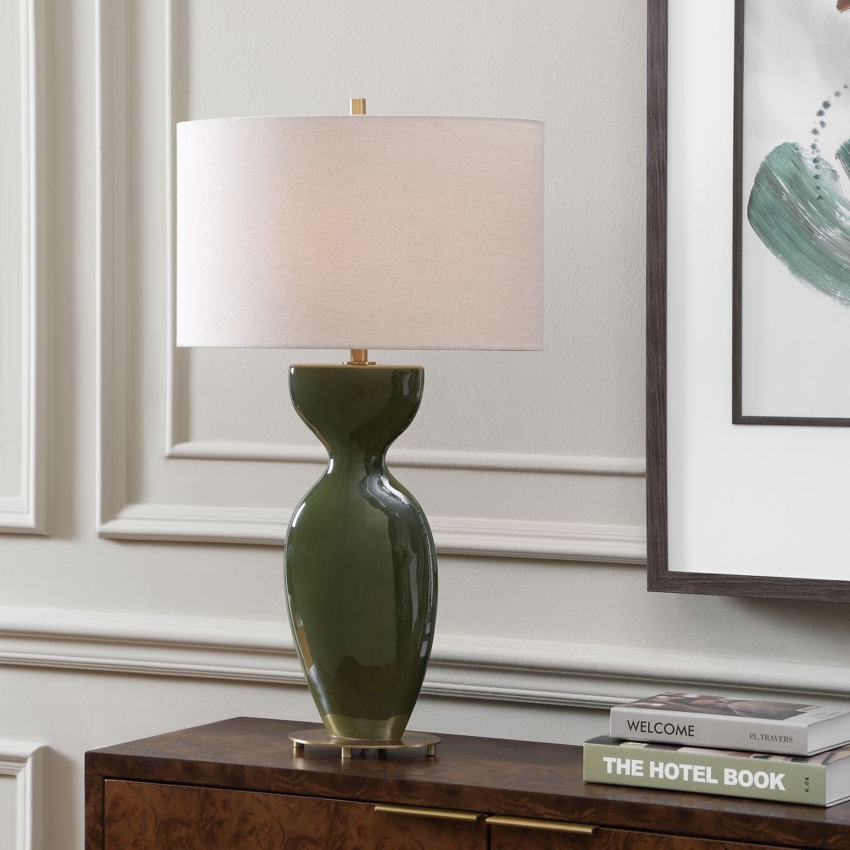Curhan Moss Green Ceramic Table Lamp styled in a styled room setting