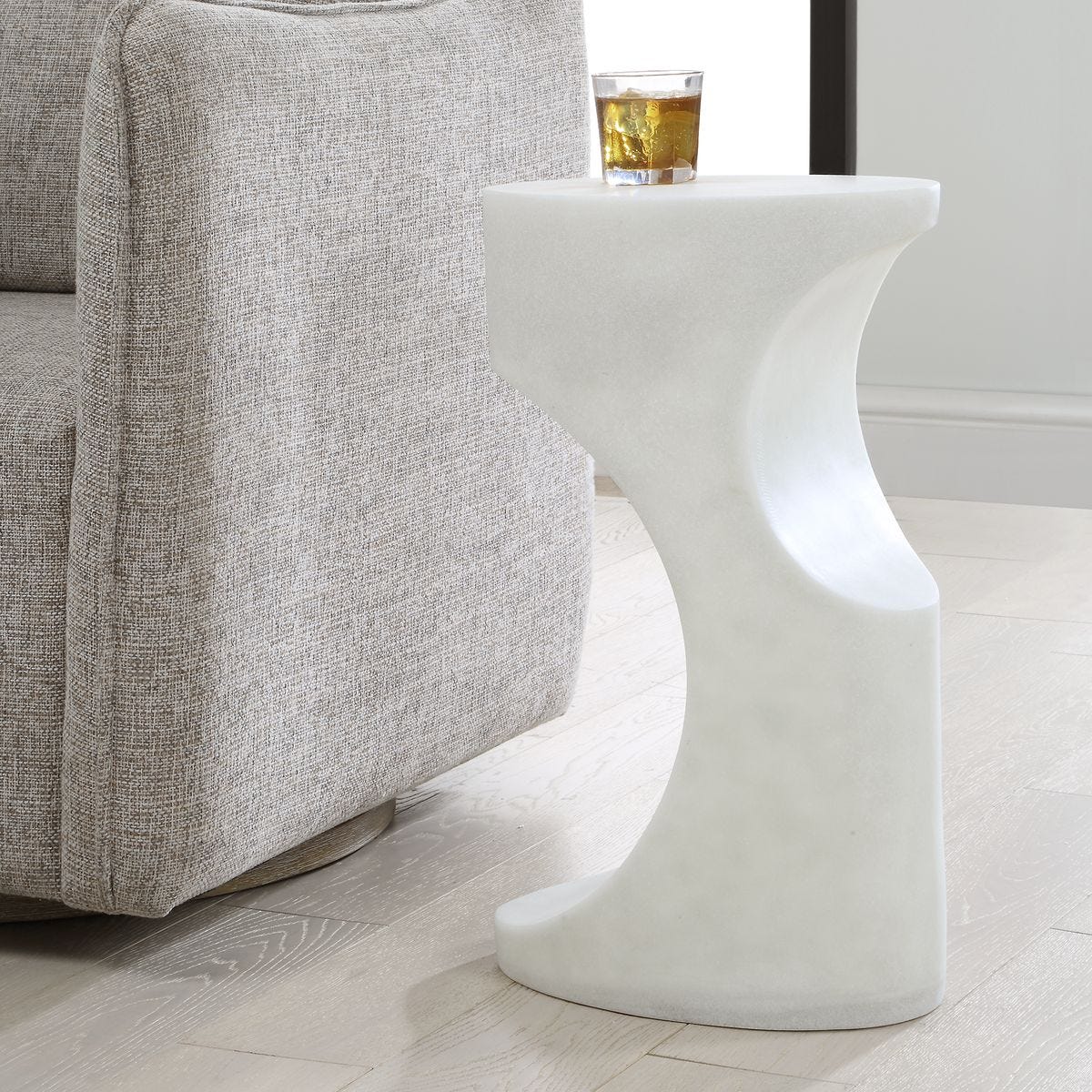 Side view of the Stevie White Stone Indoor-Outdoor Accent Table by Uttermost