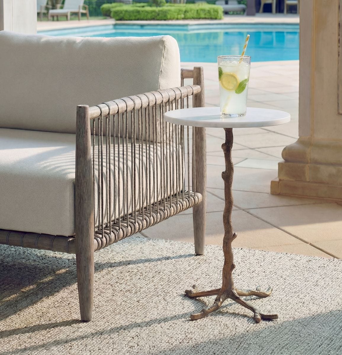 Calais Antique Brass Marble Accent Table styled in an interior setting