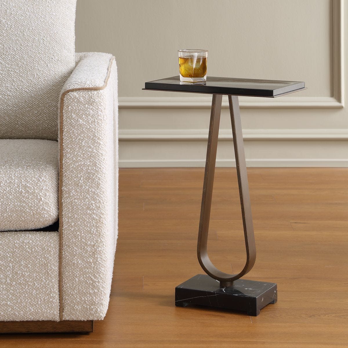 Side view of the Galloway Dark Bronze Marble Accent Table by Uttermost