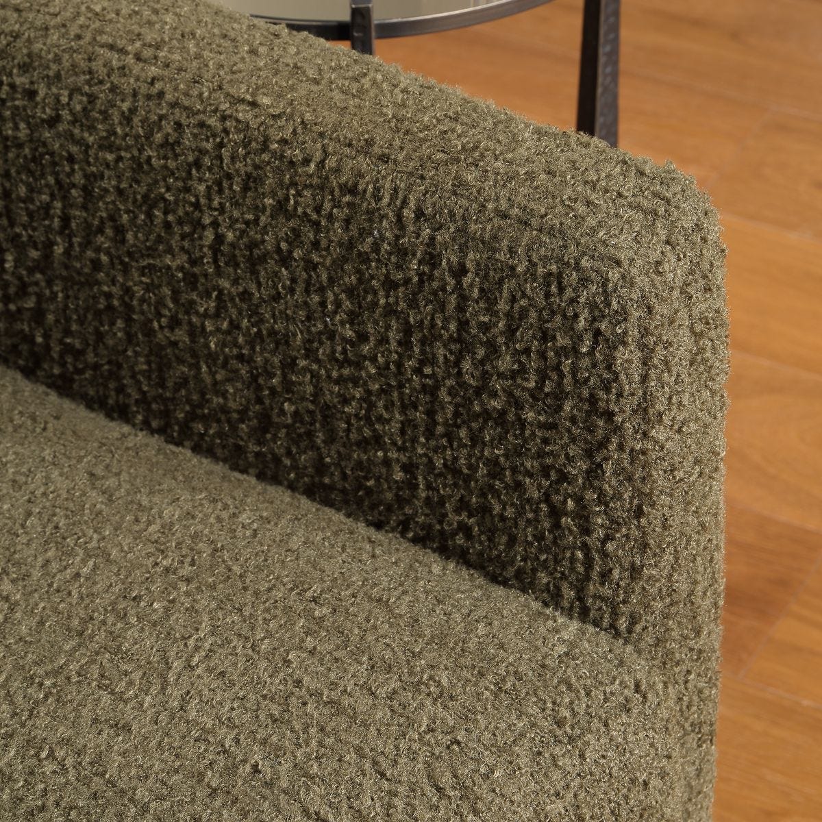 Side view of the Tisdell Kale Faux Sheepskin Swivel Chair by Uttermost