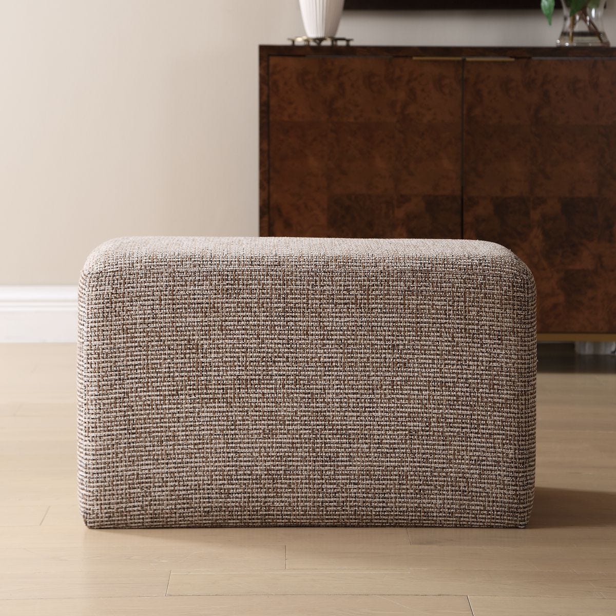 Kelce Caramel Checkered Ottoman styled in an interior setting