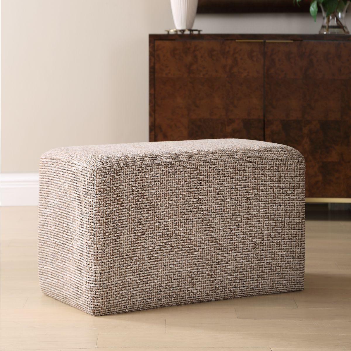 Side view of the Kelce Caramel Checkered Ottoman by Uttermost