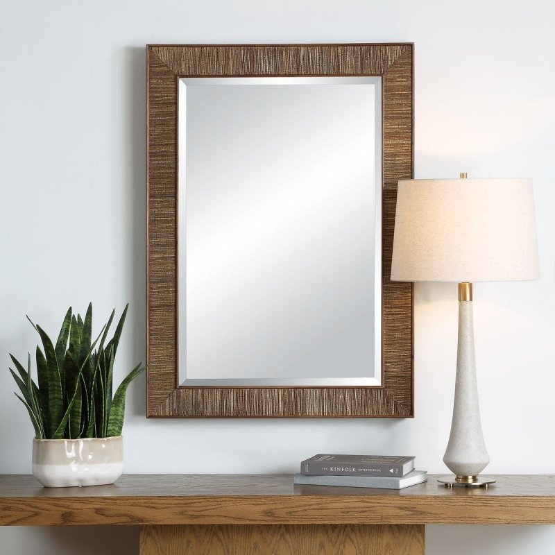 Aldous Walnut Jute Wall Mirror styled in an interior setting