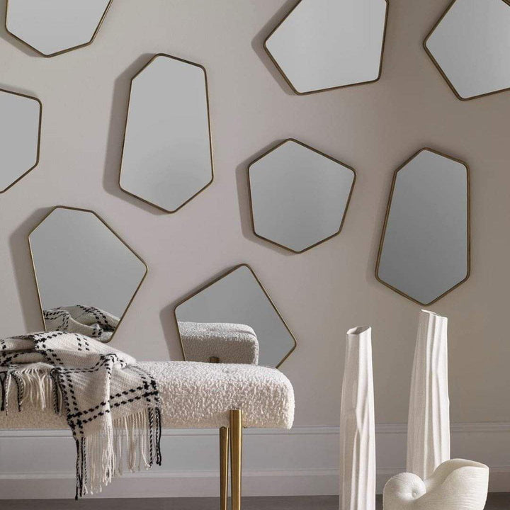 Linneah mirrors arranged on wall showing size variation and geometric patterns - Uttermost 